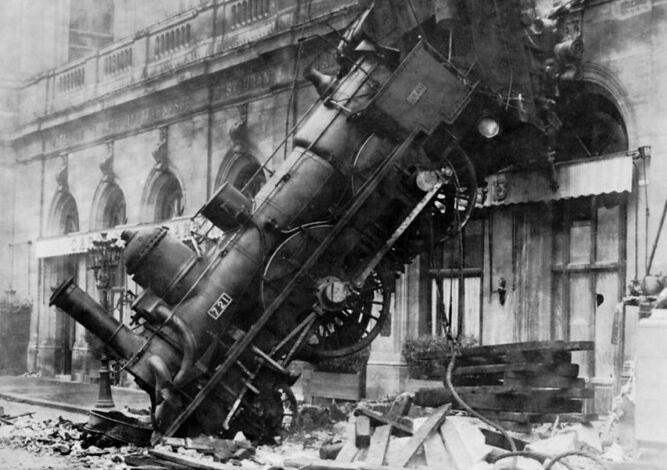 An old black and white photo of a train-wreck
